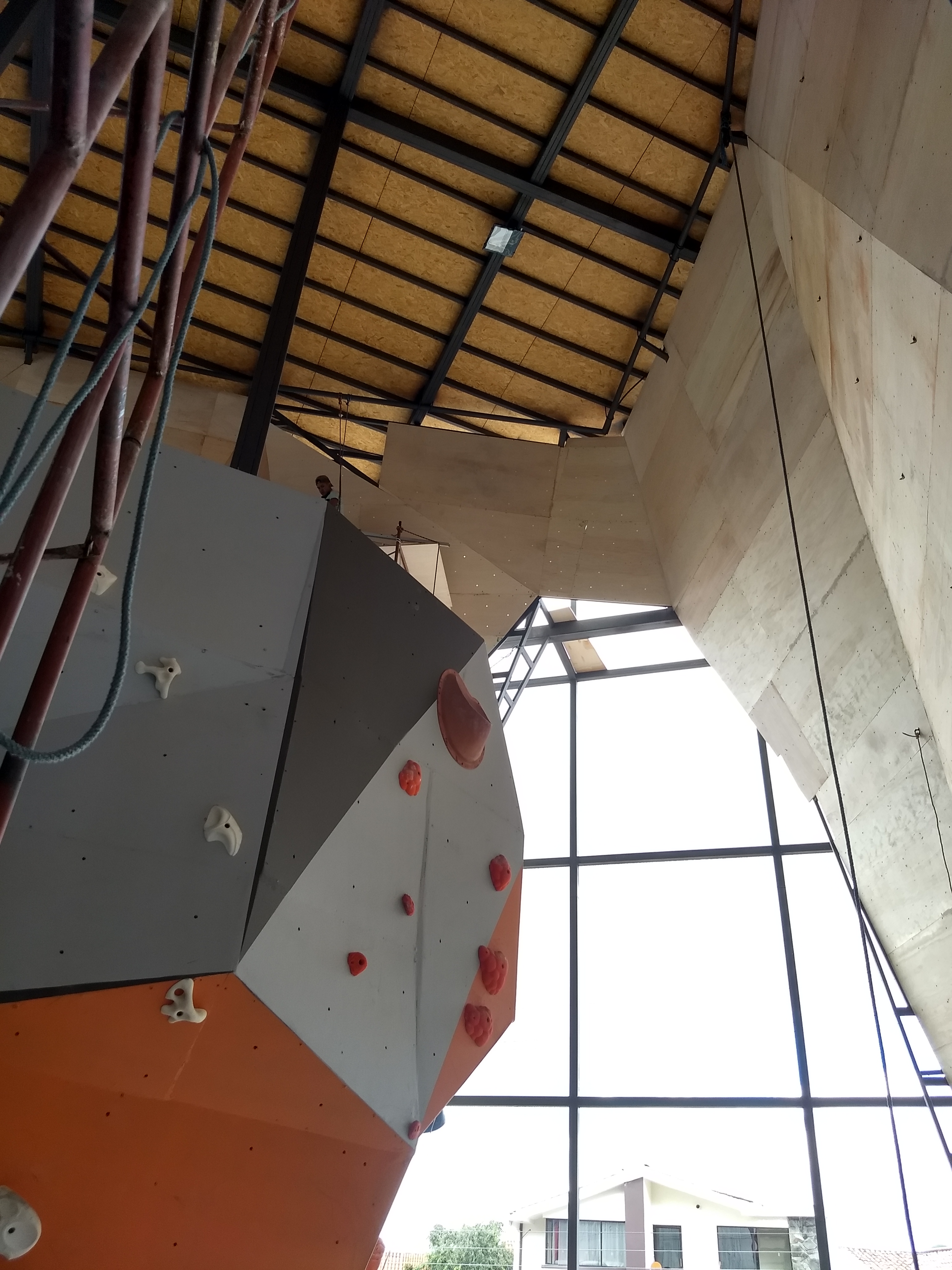 Top rope climber nearing the finish hold